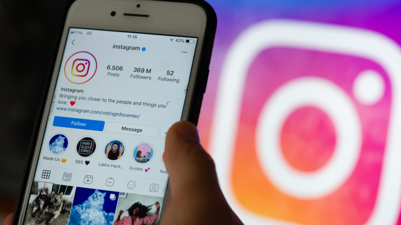  A person is holding a phone with the Instagram app open on the screen, and the Instagram logo is in the background. The alt text could be: "A person is using a VPN to view Instagram stories anonymously."