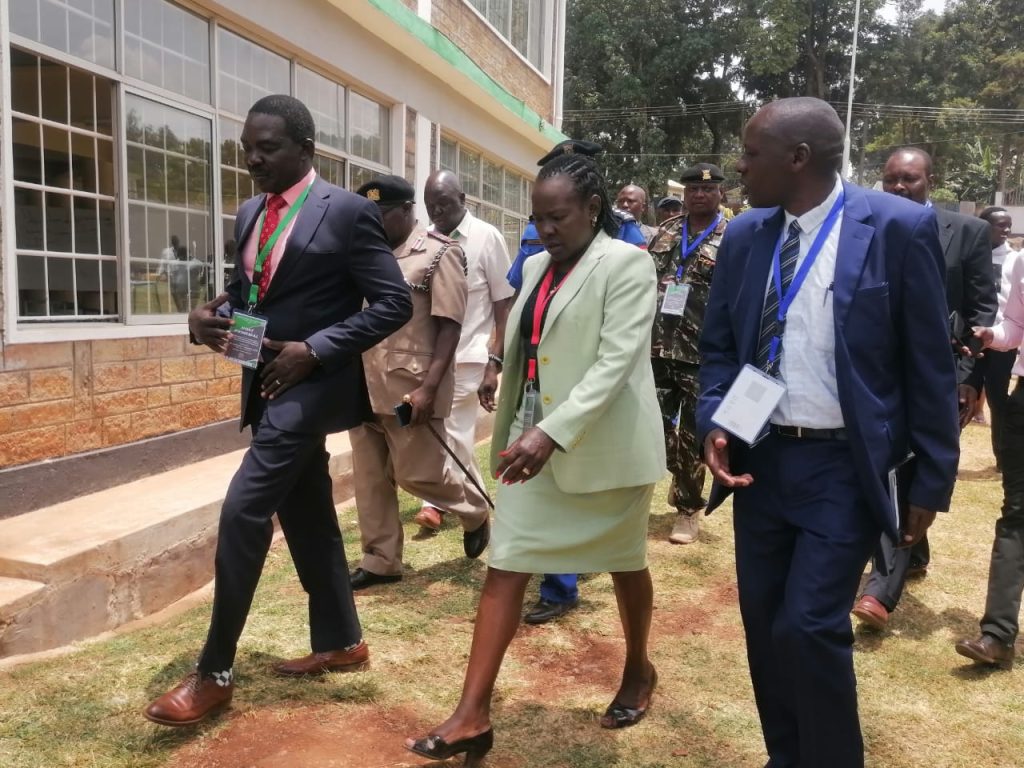 PS Tivet Dr Esther Mworia (center) flanked by Kisii National Polytechnic Principal John AKola during a visit to the institution