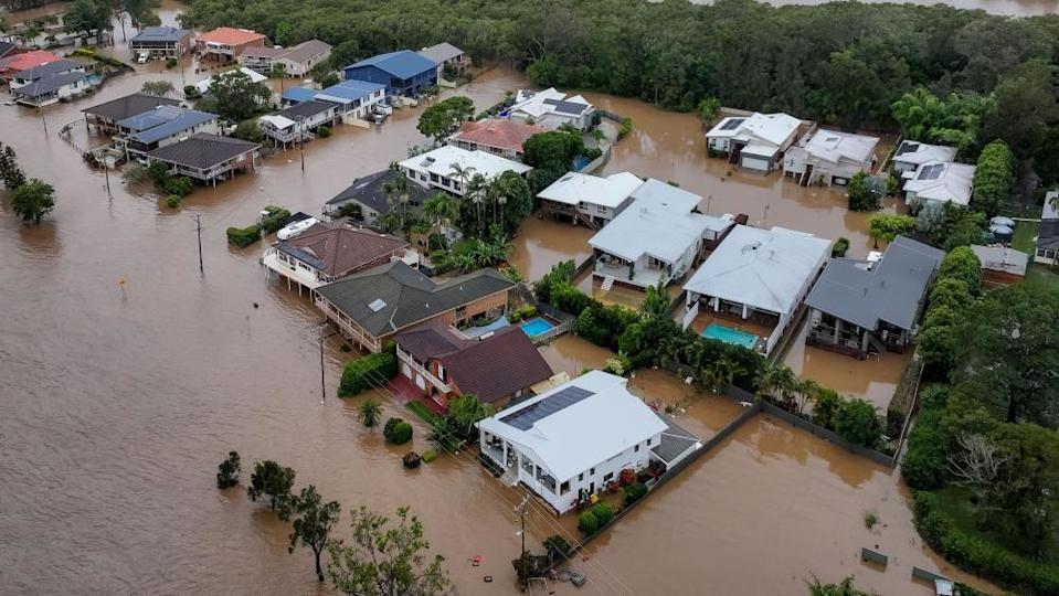 Two dead, two missing in record Australia flooding