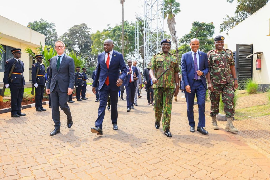 Milestone as DCI unveils WhatsApp number for anonymous crime reporting Interior CS Kipchumba Murkomen, DCI Director Mohamed Amin, British High Commissioner Neil Wigan, Inspector General Douglas Kanja, and DIG-APS Gilbert Masengeli match past a guard of honour during the launch of the upgraded Fichua Kwa DCI Centre, showcasing enhanced public crime-reporting systems supported by the UK-Kenya security partnership