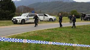 Manhunt under way after two police officers shot dead in rural Australian town