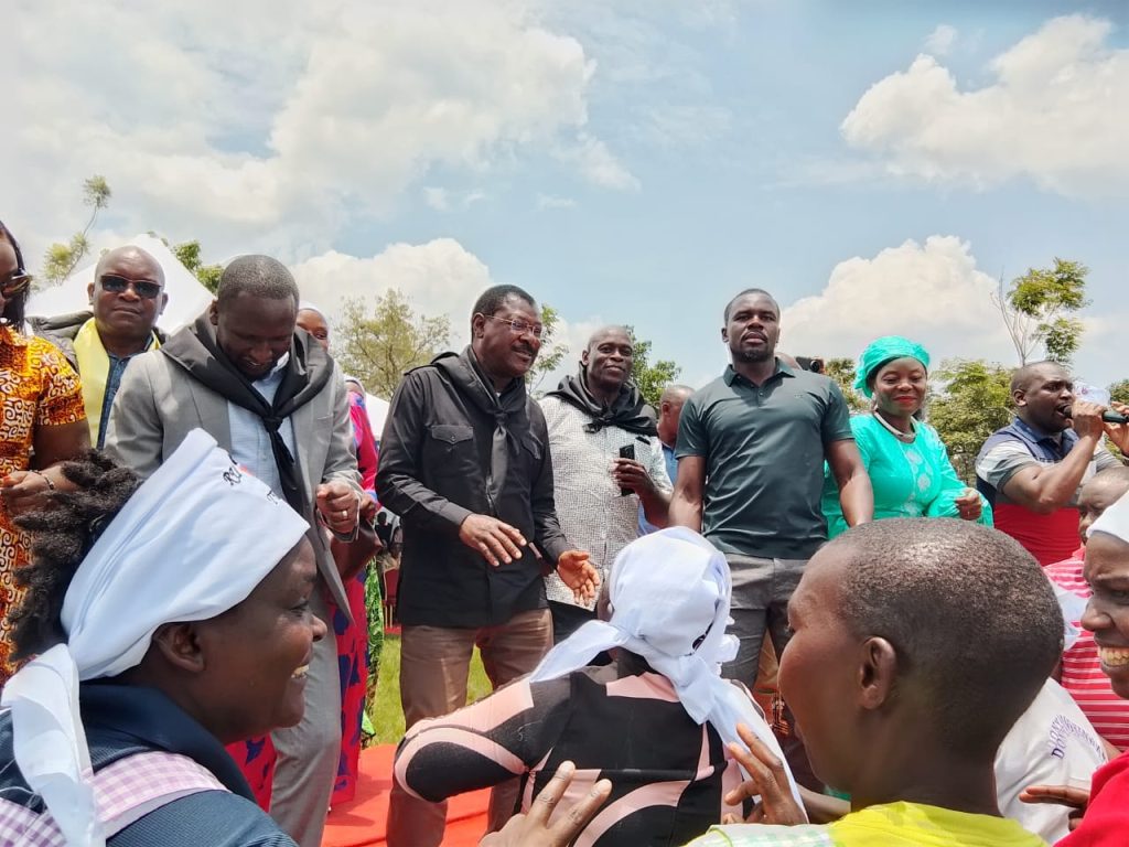 National Speaker Moses Wetangula joins a jig with a section of local residents at Mosocho on Thursday