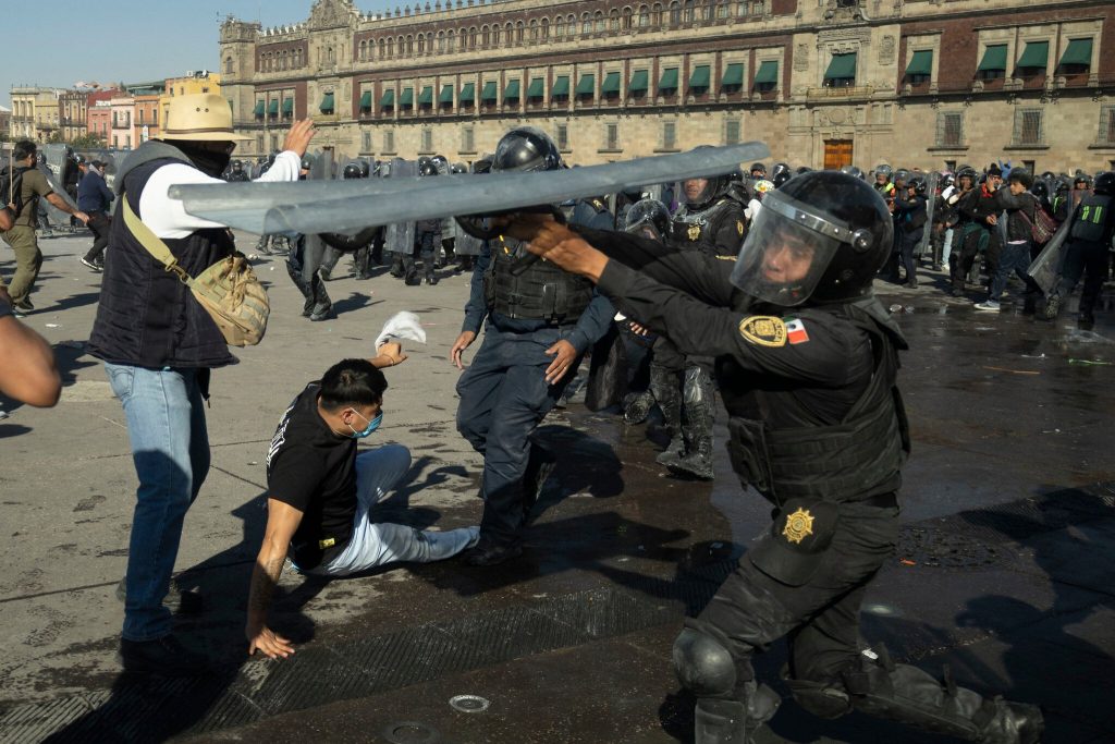 Thousands protest against government in Mexico as clashes leave 120 injured