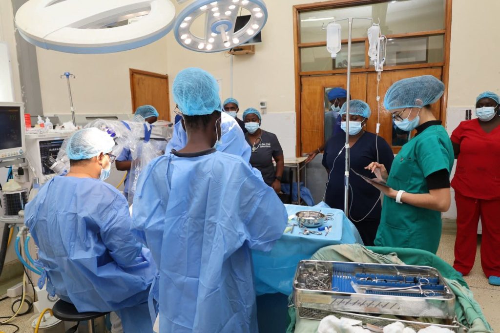 Surgeons from MTRH and Morocco performing a cochlear implant surgery in the operating theatre, assisted by the multidisciplinary medical team, as part of the ‘United, We Hear Better’ programme