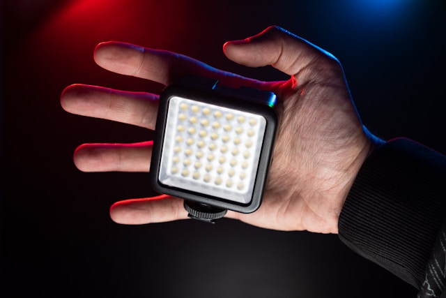 What Makes an LED Video Wall a Smart Investment for Modern Businesses Hand with LED Video Light for videomaking