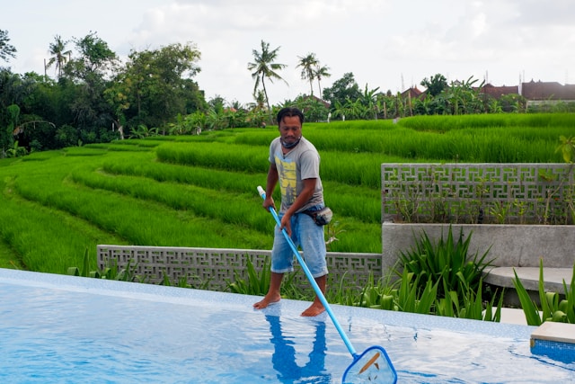 Beatbot AquaSense X vs AquaSense 2 Ultra: Which One Should You Choose? man in white polo shirt and blue denim jeans standing on swimming pool during daytime