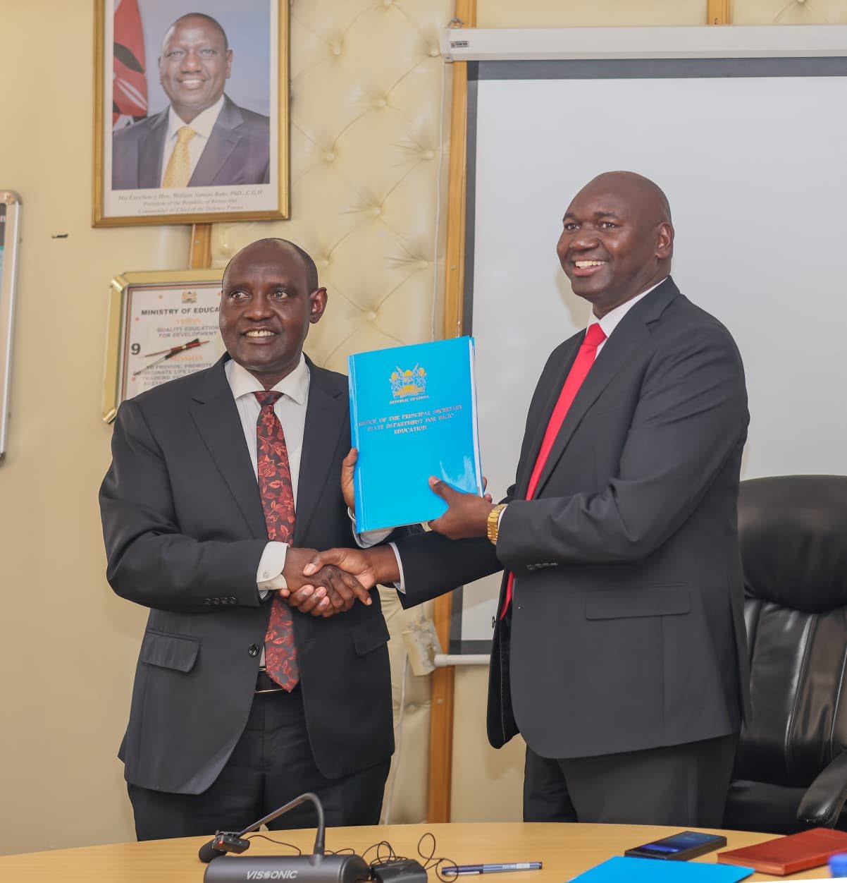 PS Bitok Hands Over Basic Education Docket to Ololtuaa After