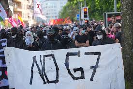 Clashes as thousands protest in Geneva ahead of G7 summit in France Clashes as thousands protest in Geneva ahead of G7 summit in France