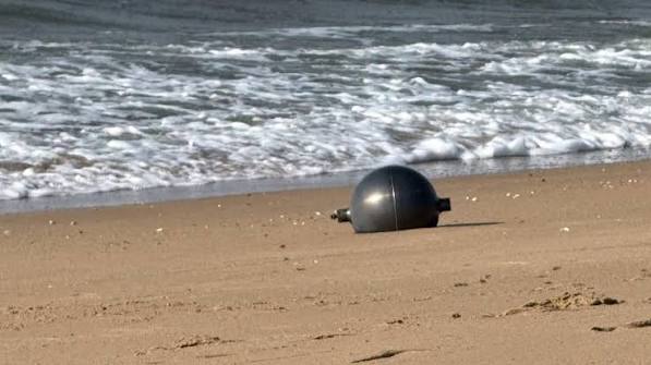 Australia probes mystery space balls that washed up on beach Australia probes mystery space balls that washed up on beach